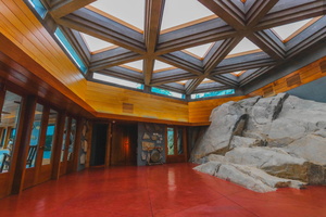 The main house is built around a large rock.