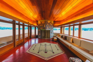 The living room is cantilevered, resembling the bow of a ship and extending into the lake.