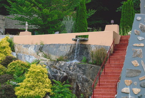 Like Fallingwater, the home incorporates a waterfall into its design.