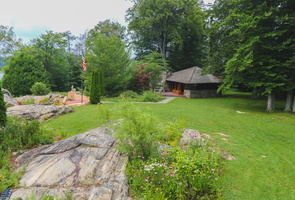 The guest house sits across the lawn.